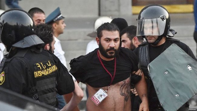 Armenia -- Photojournalist Karo Sahakian dragged by police, Yerevan, 23Jun2015